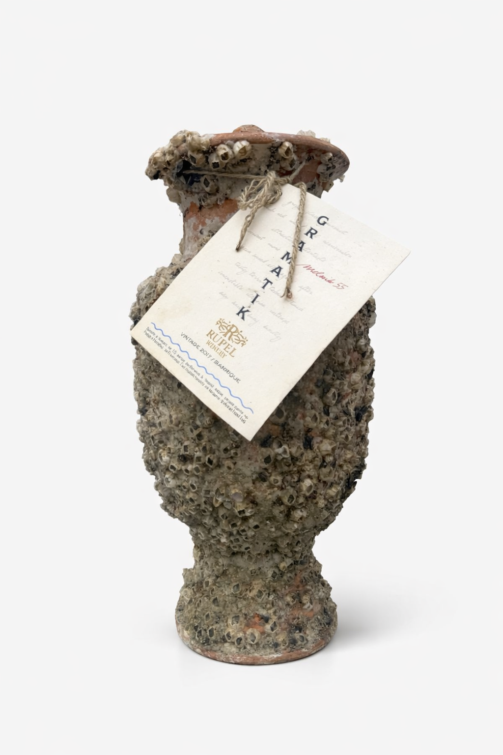 Amphora with a bottle of Gramatik Melnik 55 2017 wine